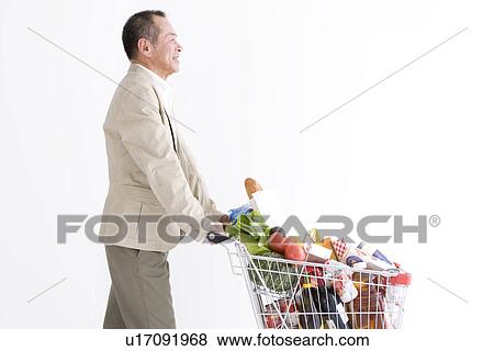 Man shopping for groceries View Large Photo Image Stock Photo - Man shopping for groceries. Fotosearch