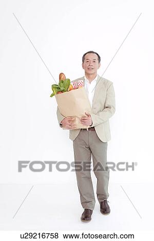 Man shopping for groceries View Large Photo Image Stock Photo - Man shopping for groceries. Fotosearch