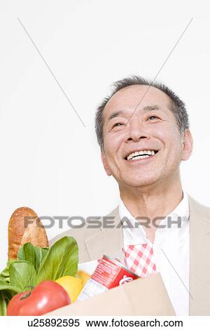 Man shopping for groceries View Large Photo Image Stock Photography - Man shopping for groceries. Fotosearch