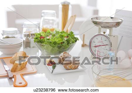 Stock Photograph - Meal being prepared on kitchen bench. Fotosearch