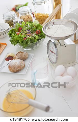 Stock Photography - Meal being prepared on kitchen bench. Fotosearch