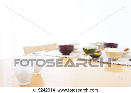 Picture - Miso soup with meal in the background. Fotosearch