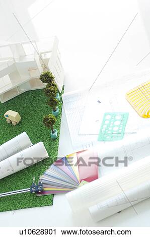 Stock Image - Model building, building plans and colour swatch. Fotosearch