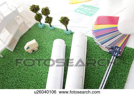 Stock Photograph - Model building, building plans and colour swatch. Fotosearch