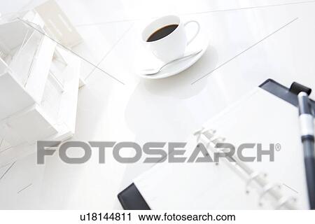 Stock Image - Model building, diary and coffee cup. Fotosearch