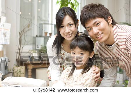 Mother, father and little girl View Large Photo Image Stock Image - Mother, father and little girl. Fotosearch