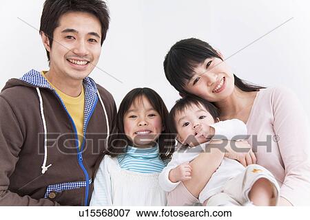 Stock Photo - Mother, father, daughter and baby boy. Fotosearch