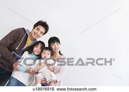 Stock Photo - Mother, father, daughter and baby boy. Fotosearch