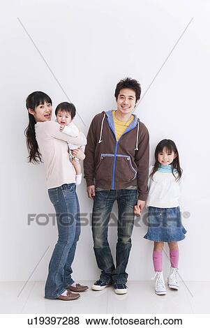 Stock Photo - Mother, father, daughter and baby boy. Fotosearch