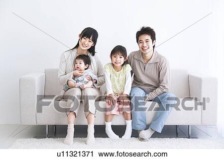 Mother, father daughter and baby son sitting on couch View Large Photo Image Stock Image - Mother, father daughter and baby son sitting on couch. Fotosearch