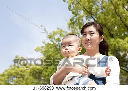 Mother hugging her baby View Large Photo Image Stock Image - Mother hugging her baby. Fotosearch