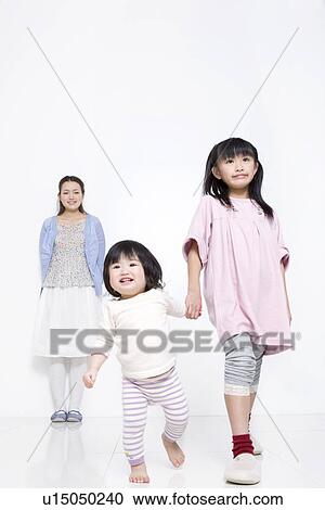 Stock Image - Mother with two daughters. Fotosearch
