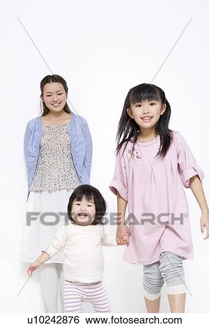 Stock Photograph - Mother with two daughters. Fotosearch
