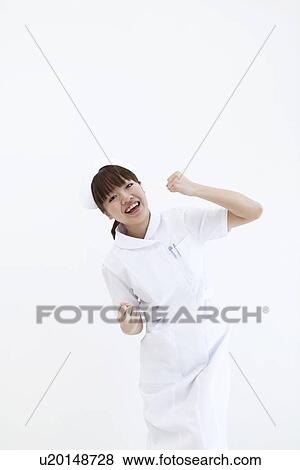 Stock Photo - Nurse doing victory pose. Fotosearch