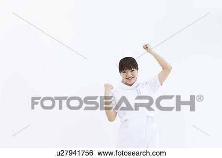 Stock Photograph - Nurse doing victory pose. Fotosearch