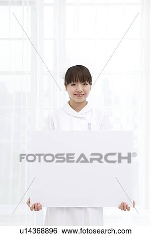 Nurse with blank message board View Large Photo Image Stock Photograph - Nurse with blank message board. Fotosearch