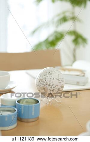Stock Photo - Office with globe on desk. Fotosearch