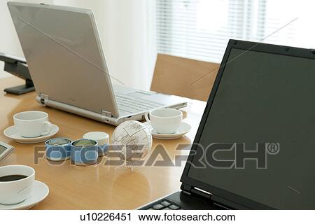 Office with laptops on desk View Large Photo Image Stock Image - Office with laptops on desk. Fotosearch