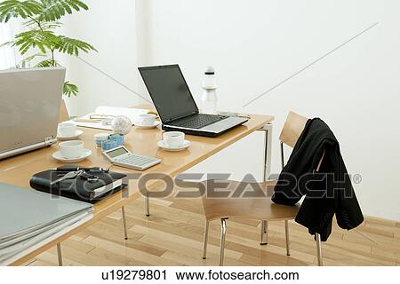 Stock Image - Office with laptops on desk. Fotosearch
