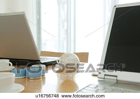 Office with laptops on desk View Large Photo Image Stock Photo - Office with laptops on desk. Fotosearch