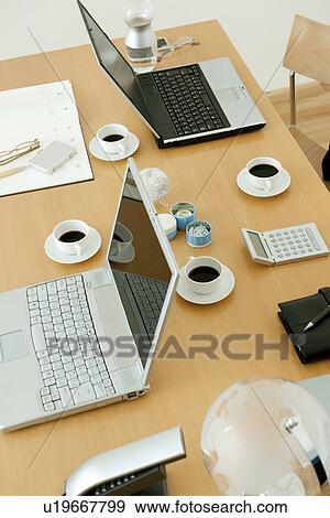Office with laptops on desk View Large Photo Image Stock Photo - Office with laptops on desk. Fotosearch