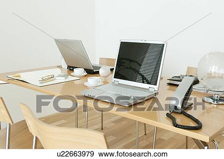Office with laptops on desk View Large Photo Image Stock Photo - Office with laptops on desk. Fotosearch