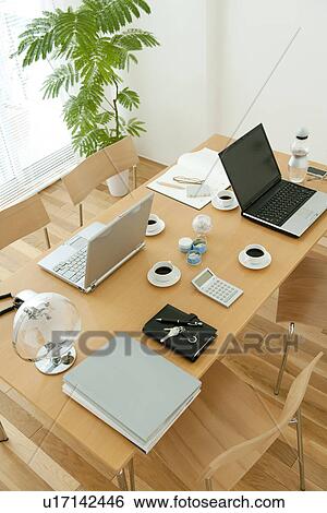 Stock Photograph - Office with laptops on desk. Fotosearch