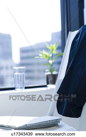 Stock Photo - Office with potted plant by the window. Fotosearch