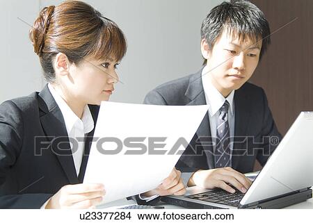Picture - Office workers in a meeting. Fotosearch