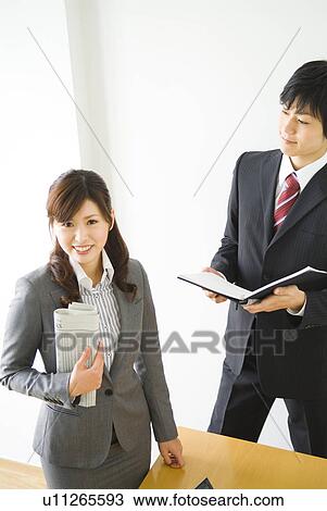 Office workers smiling in suits View Large Photo Image Stock Image - Office workers smiling in suits. Fotosearch