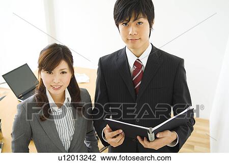 Office workers smiling in suits View Large Photo Image Stock Image - Office workers smiling in suits. Fotosearch