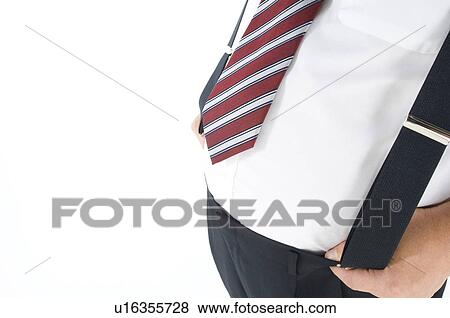 Stock Photo - Overweight businessman with a pot belly holding his suspenders. Fotosearch