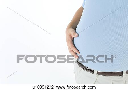 Overweight man holding his pot belly View Large Photo Image Stock Image - Overweight man holding his pot belly. Fotosearch