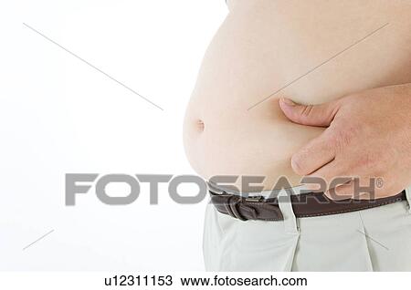 Stock Image - Overweight man pinching his pot belly. Fotosearch