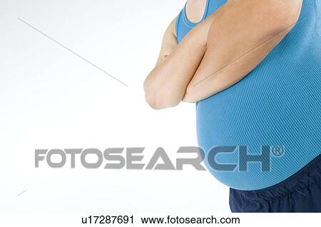 Overweight man with a pot belly in gym gear View Large Photo Image Stock Image - Overweight man with a pot belly in gym gear. Fotosearch