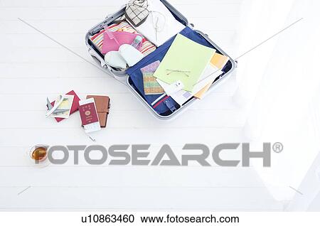 Packed suitcase lying open View Large Photo Image Stock Image - Packed suitcase lying open. Fotosearch