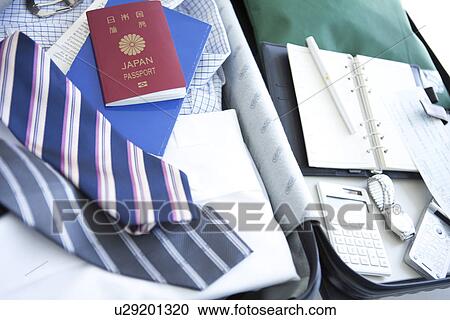 Packed suitcase lying open View Large Photo Image Stock Image - Packed suitcase lying open. Fotosearch
