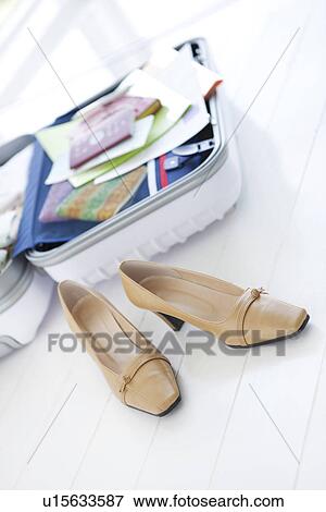 Stock Photo - Packed suitcase lying open. Fotosearch