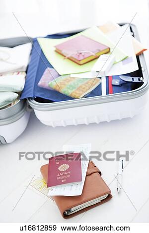 Stock Photo - Packed suitcase lying open. Fotosearch