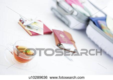 Stock Photograph - Packed suitcase lying open. Fotosearch