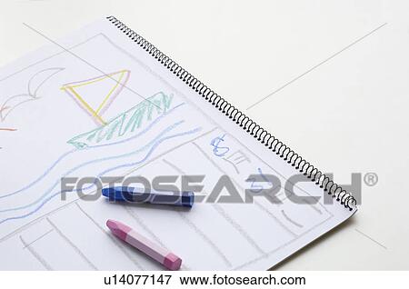 Stock Photo - Pastel crayons and a drawing on a notepad. Fotosearch