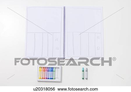Stock Photograph - Pastel crayons and a note pad. Fotosearch