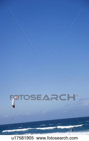 Stock Photography - People kiteboarding at sea. Fotosearch
