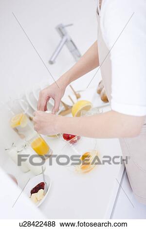 Person breaking eggs into bowl View Large Photo Image Stock Photo - Person breaking eggs into bowl. Fotosearch