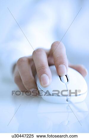 Stock Photography - Person holding a computer mouse. Fotosearch