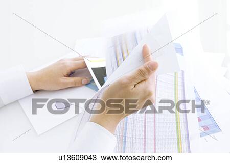 Person looking through documents View Large Photo Image Stock Image - Person looking through documents. Fotosearch