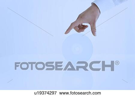 Person reaching towards compact disc View Large Photo Image Stock Photo - Person reaching towards compact disc. Fotosearch