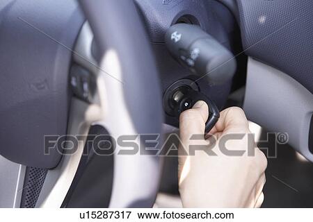 Person turning key in ignition View Large Photo Image Stock Photo - Person turning key in ignition. Fotosearch