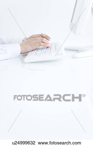 Stock Image - Person typing on computer keyboard. Fotosearch