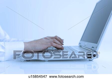 Stock Photo - Person typing on keyboard. Fotosearch